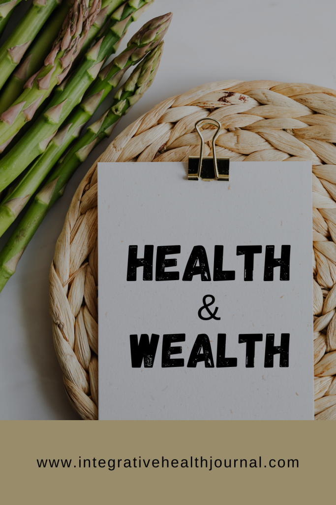 Clipboard with "Health & Wealth" text, asparagus, and woven mat.